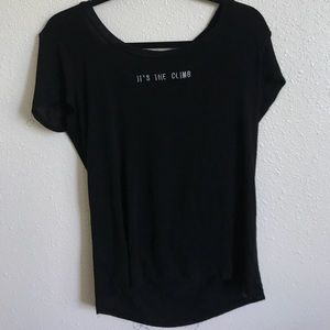 Black tee with “ IT’S THE CLIMB” on the front